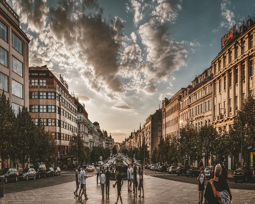 People walking near Monastiraki square during sunset in Athens